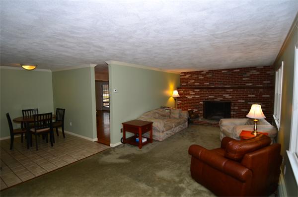 43 Jacob Gates Road Harvard, MA 01451 - Photo 4 of 17 a living room with furniture and a fireplace
