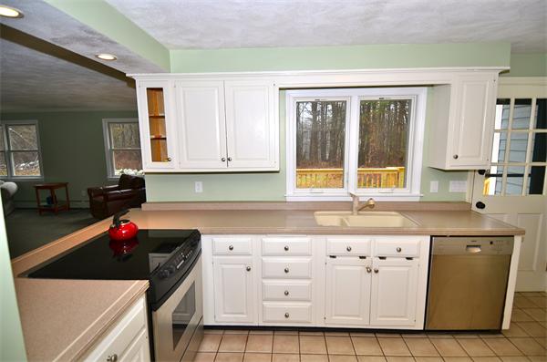 43 Jacob Gates Road Harvard, MA 01451 - Photo 8 of 17 a kitchen with granite countertop a sink a stove and cabinets