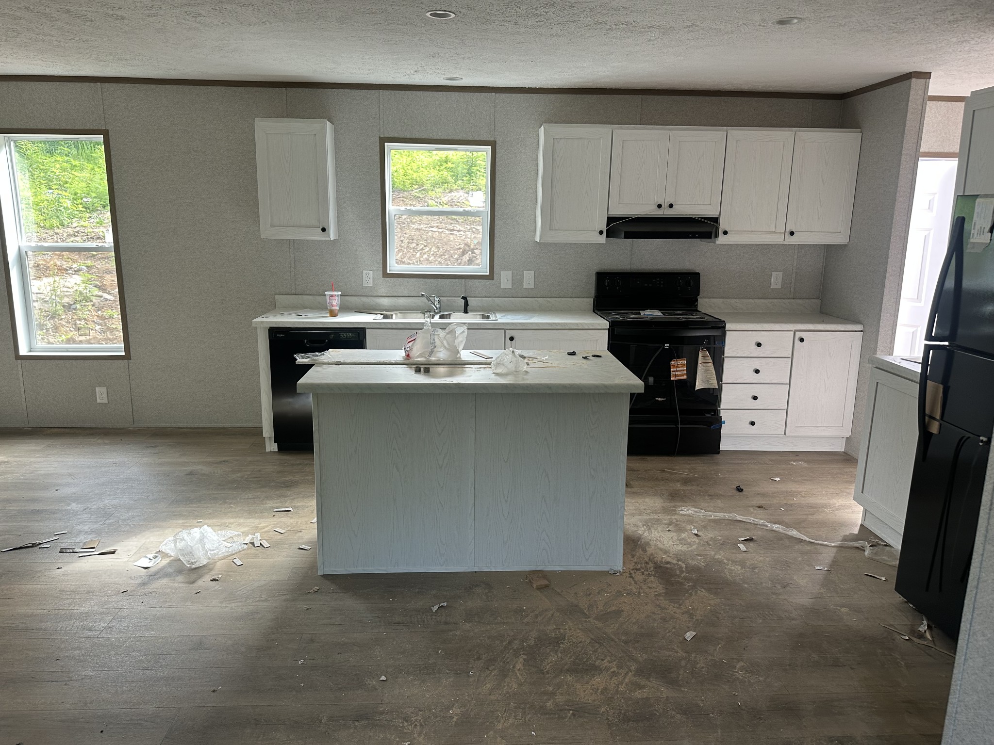 406 Shiloh Church Road Woodbury, TN 37190 - Photo 14 of 18 a kitchen with stainless steel appliances granite countertop a sink stove and refrigerator