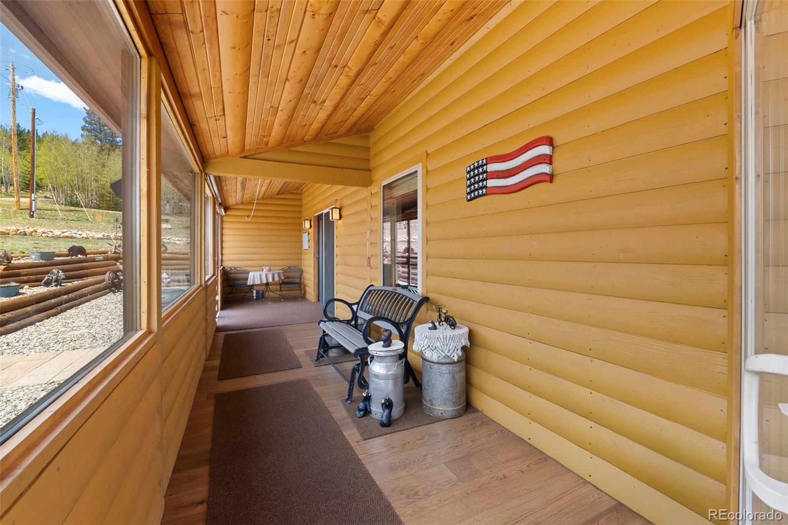 1163 Michigan Hill Road Jefferson, CO 80456 - Photo 19 of 48 a view of a porch with furniture