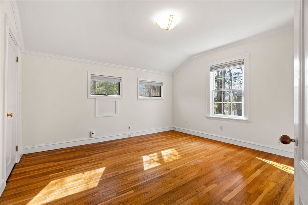 60 Oxford Road Newton, MA 02459 - Photo 21 of 42 a view of an empty room with wooden floor and a window