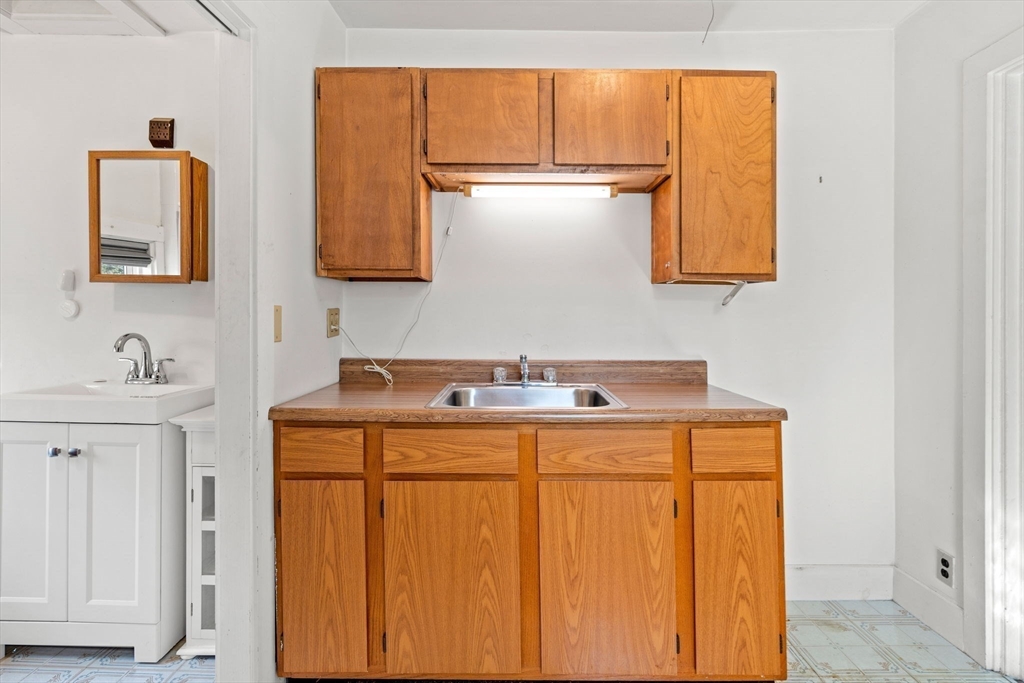 60 Oxford Road Newton, MA 02459 - Photo 30 of 42 a utility room with a sink