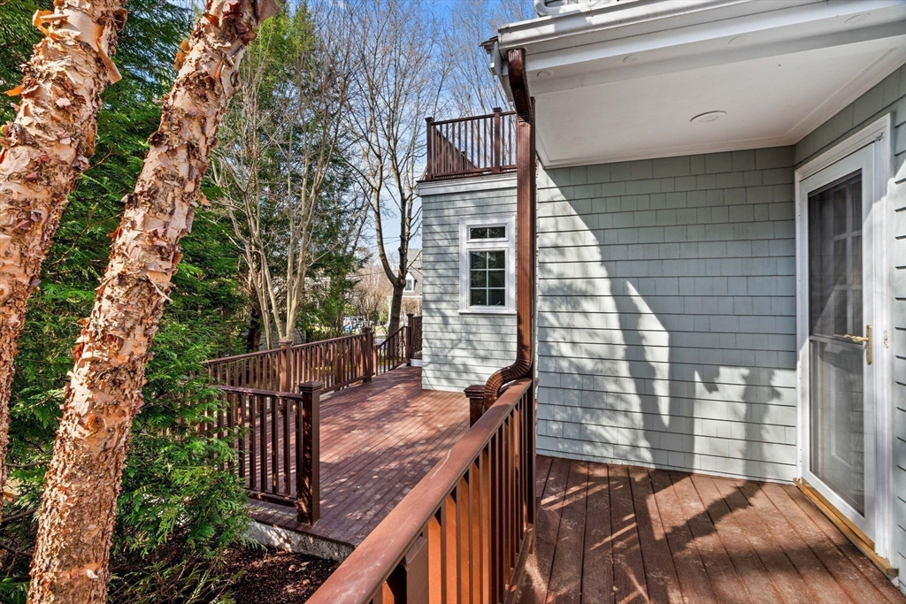 60 Oxford Road Newton, MA 02459 - Photo 36 of 42 a view of balcony with wooden floor and fence