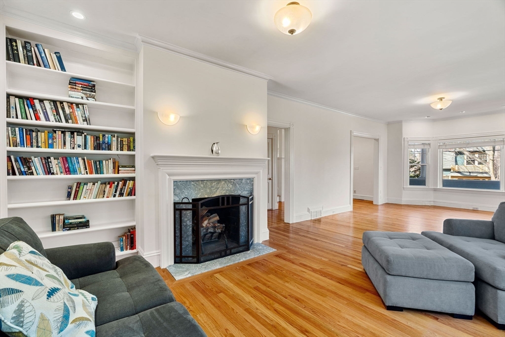 60 Oxford Road Newton, MA 02459 - Photo 10 of 42 a living room with furniture and a fireplace