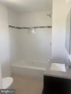 a bathroom with a shower and a toilet