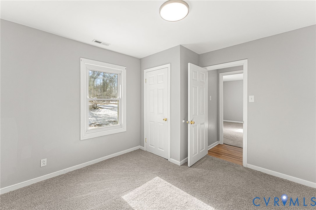 1847 Darbytown Road Henrico, VA 23231 - Photo 18 of 25 a view of an empty room with closet and a window