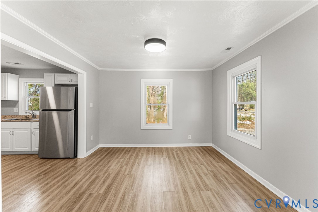 1847 Darbytown Road Henrico, VA 23231 - Photo 5 of 25 wooden floor in an empty room with a window