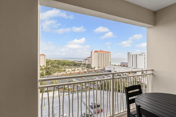 a view of a balcony with furniture