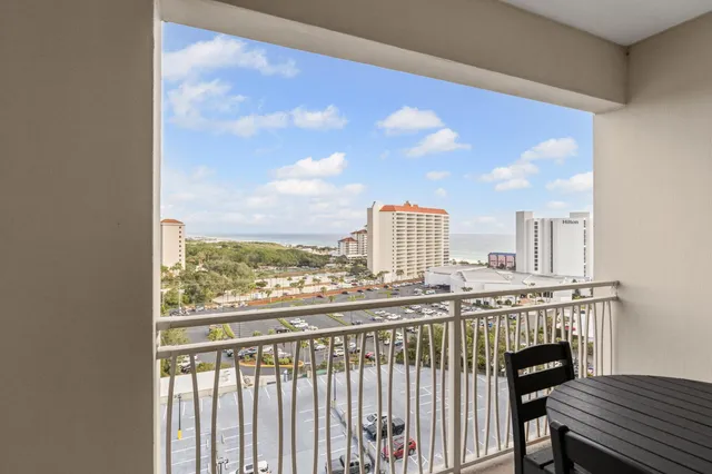 a view of a balcony with furniture