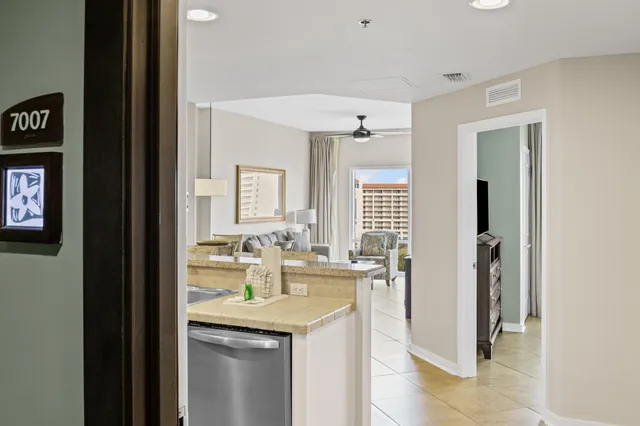 a kitchen with sink and refrigerator