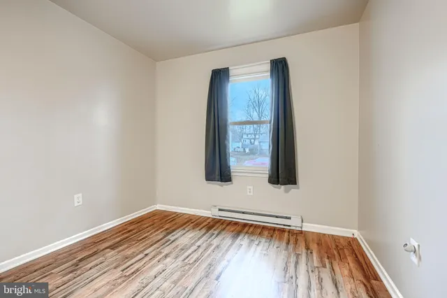 a bathroom with a sink vanity mirror and toilet