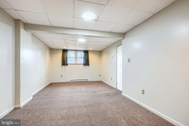 a backyard of a building with large trees