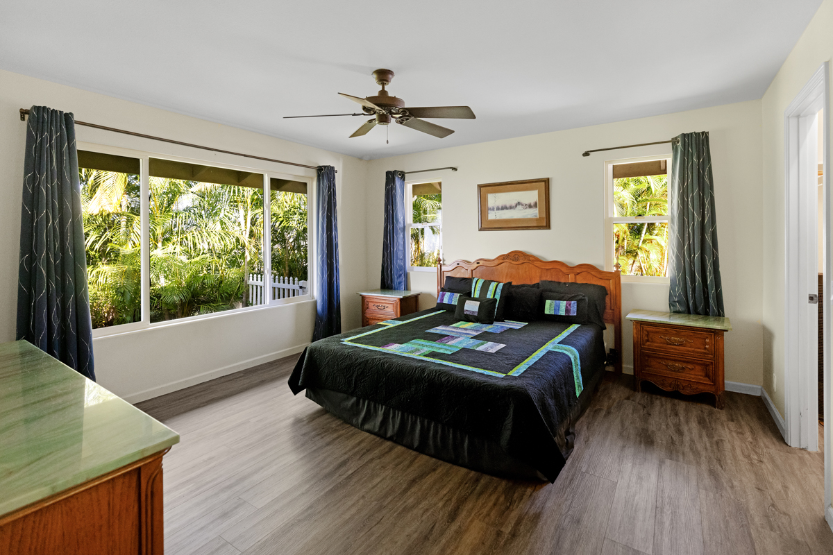 77-6596 Walua Road Kailua-Kona, HI 96740 - Photo 13 of 20 a bedroom with a bed and wooden floor