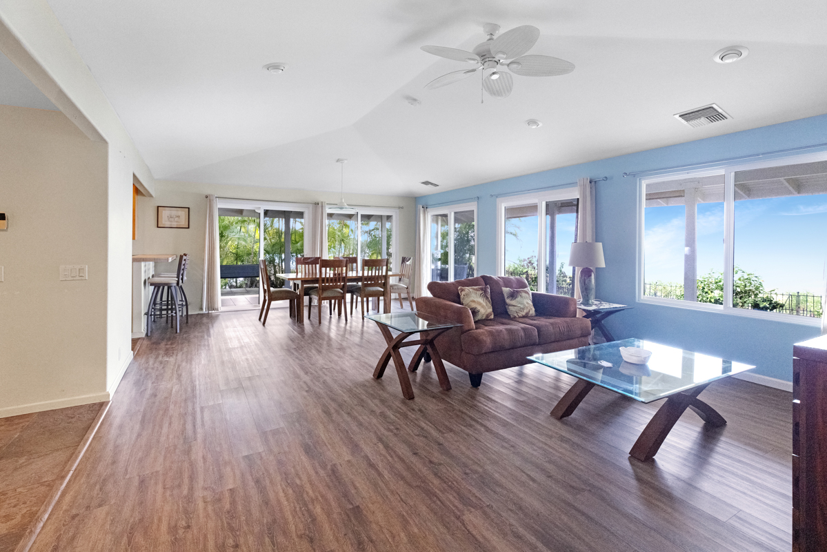 77-6596 Walua Road Kailua-Kona, HI 96740 - Photo 6 of 20 a living room with furniture dining table and wooden floor
