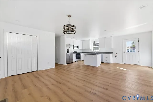a view of kitchen with wooden floor