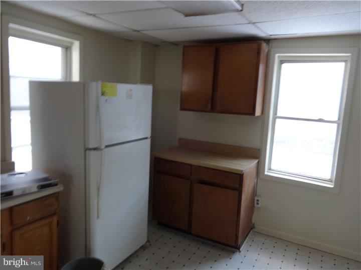 905 Wagontown Road Coatesville, PA 19320 - Photo 5 of 11 a kitchen with a refrigerator and window