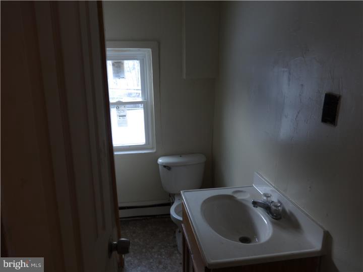 905 Wagontown Road Coatesville, PA 19320 - Photo 10 of 11 a bathroom with a sink and a toilet