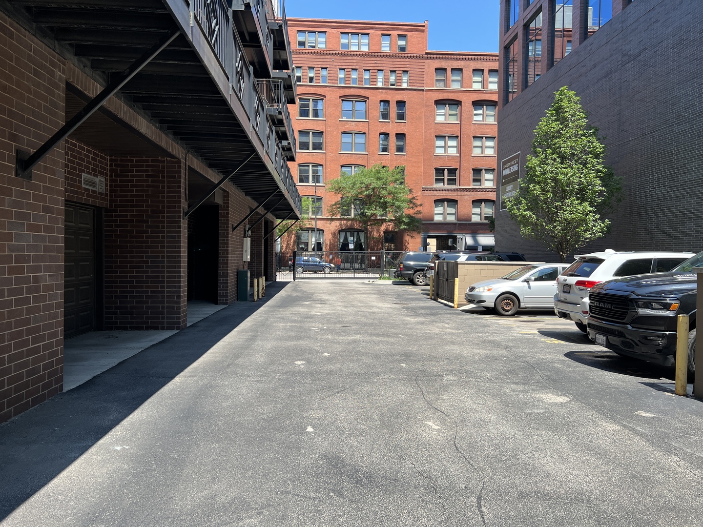 31 North Morgan Street, Unit 2 Chicago, IL 60607 - Photo 15 of 17 a view of a cars parked in front of a building