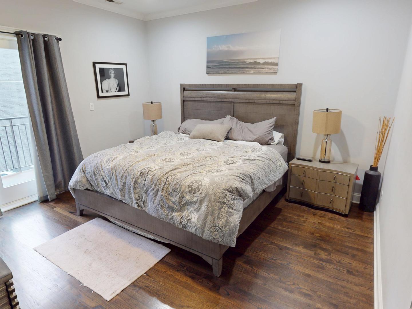 31 North Morgan Street, Unit 2 Chicago, IL 60607 - Photo 8 of 17 a bedroom with a bed and a night stand