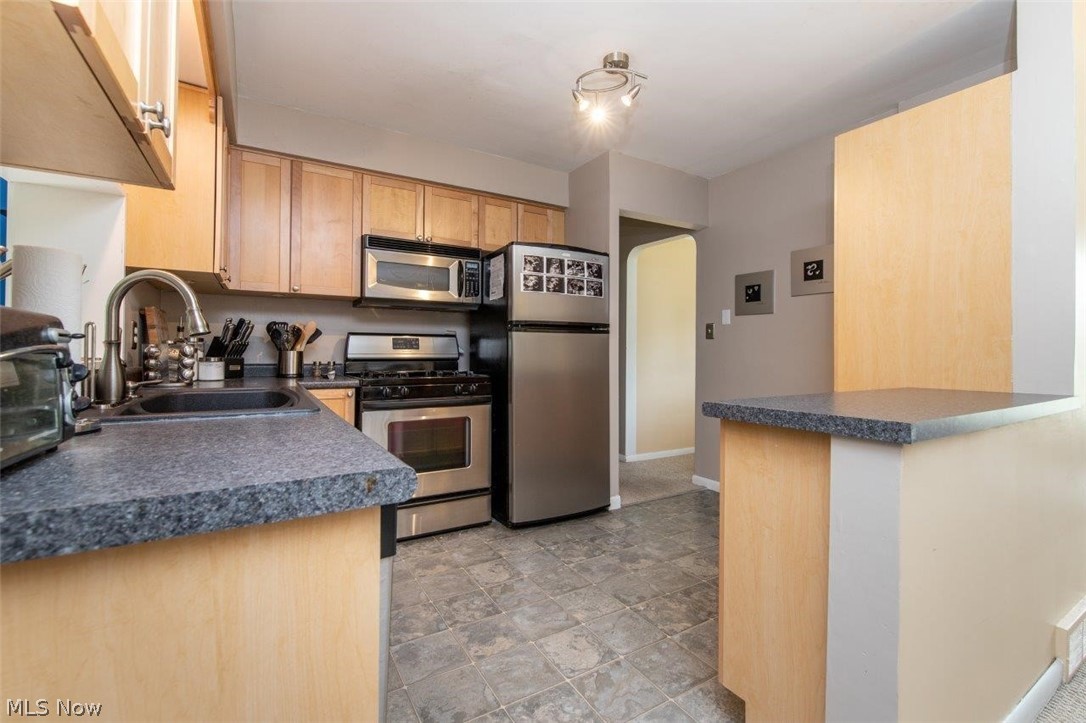 1255 Blanchester Road Lyndhurst, OH 44124 - Photo 11 of 29 Updated Kitchen Featuring Kraftmaid Cabinets and Stainless Appliances