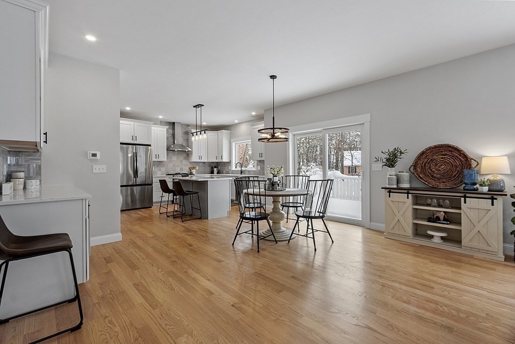 145 New Estate Road Littleton, MA 01460 - Photo 11 of 41 a view of a dining room with furniture and wooden floor