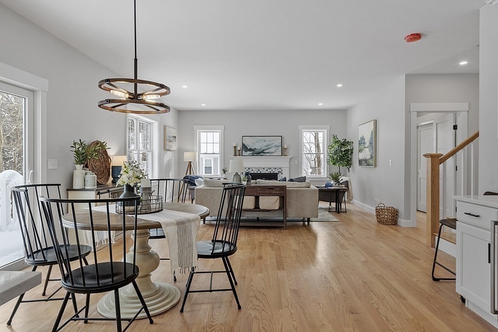 145 New Estate Road Littleton, MA 01460 - Photo 12 of 41 a view of a dining room with furniture window and wooden floor