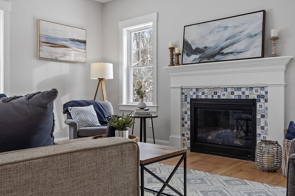 145 New Estate Road Littleton, MA 01460 - Photo 14 of 41 a living room with furniture and a fireplace