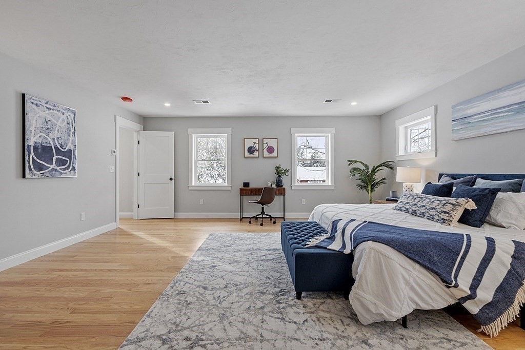 145 New Estate Road Littleton, MA 01460 - Photo 21 of 41 a spacious bedroom with a large bed and a window