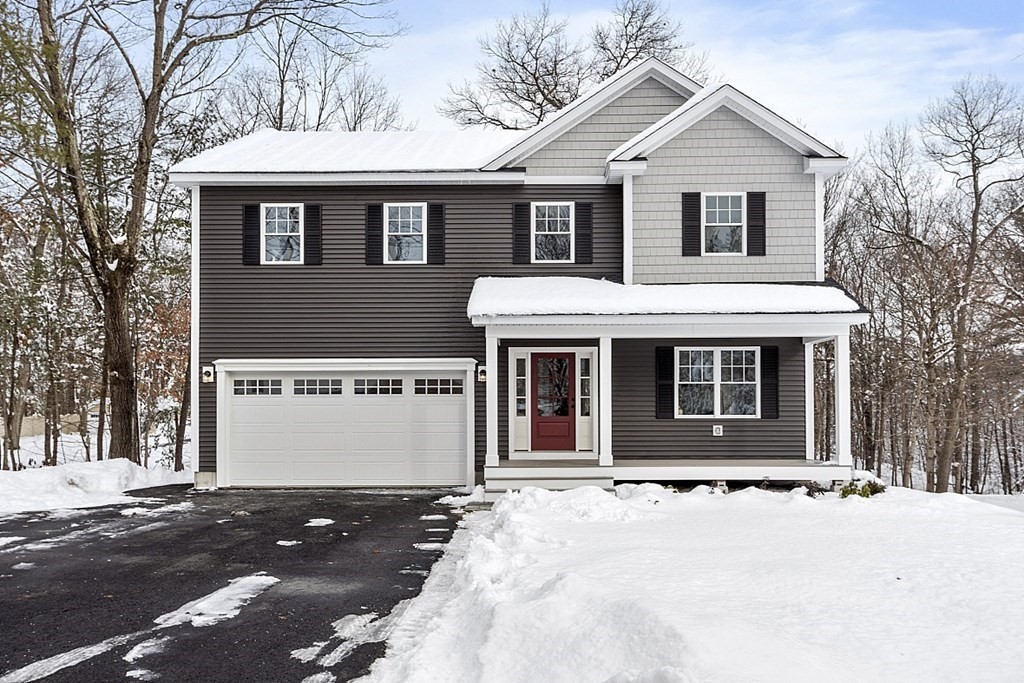 145 New Estate Road Littleton, MA 01460 - Photo 3 of 41 a front view of a house with a yard