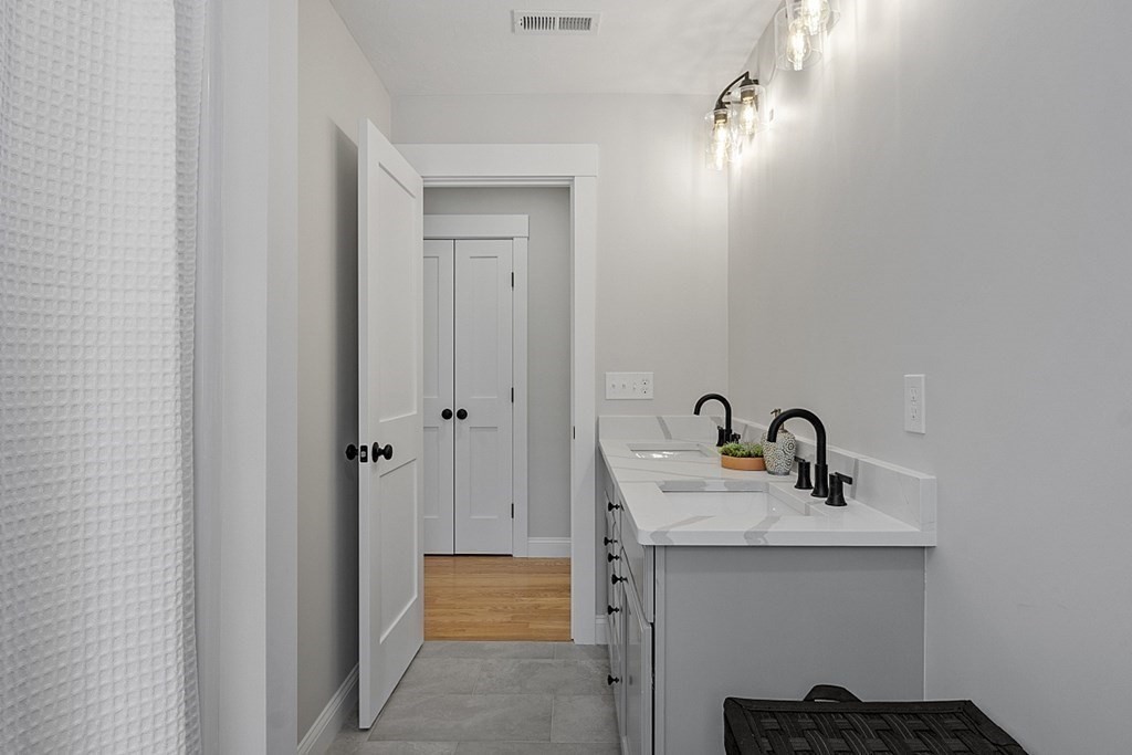 145 New Estate Road Littleton, MA 01460 - Photo 36 of 41 a bathroom with a sink and mirror