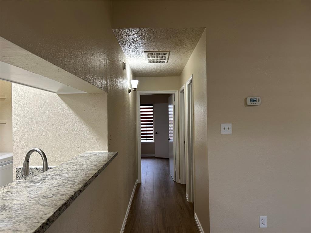 4101 Esters Road, Unit 103 Irving, TX 75038 - Photo 5 of 14 a view of a hallway view with staircase