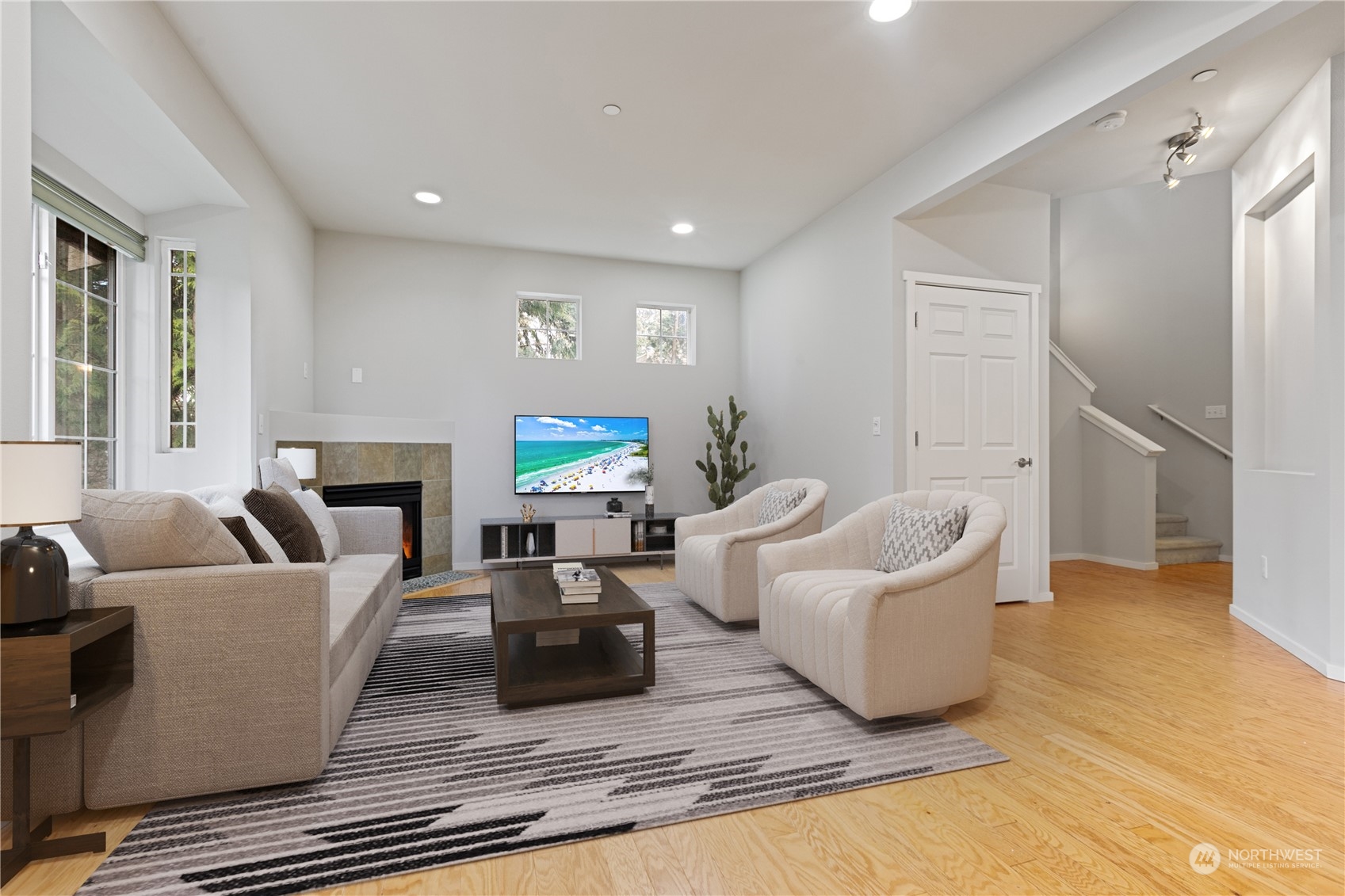 20734 76th Avenue West, Unit D Edmonds, WA 98026 - Photo 11 of 32 a living room with furniture and a flat screen tv