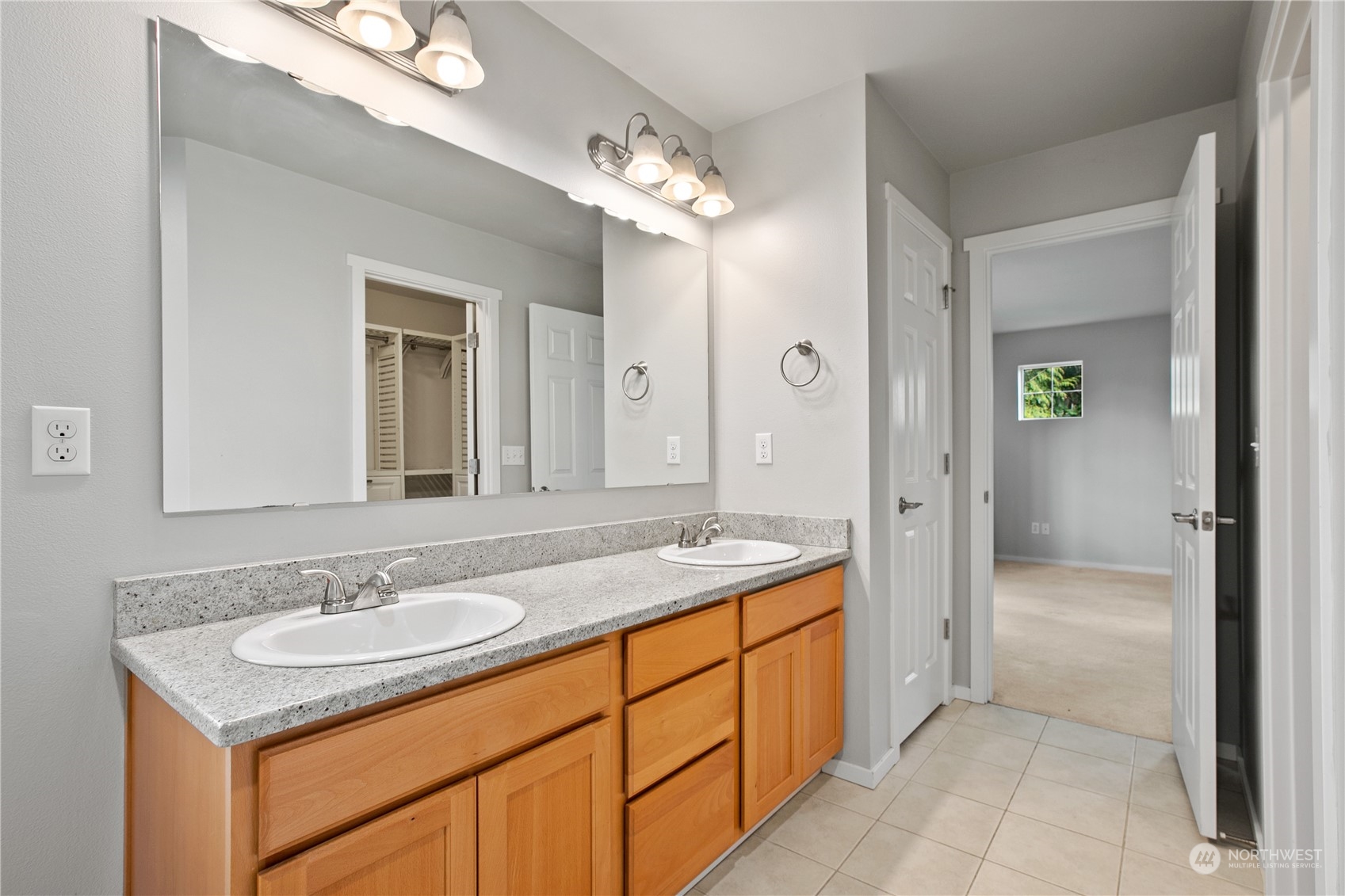 20734 76th Avenue West, Unit D Edmonds, WA 98026 - Photo 21 of 32 a spacious bathroom with a granite countertop sink and a mirror