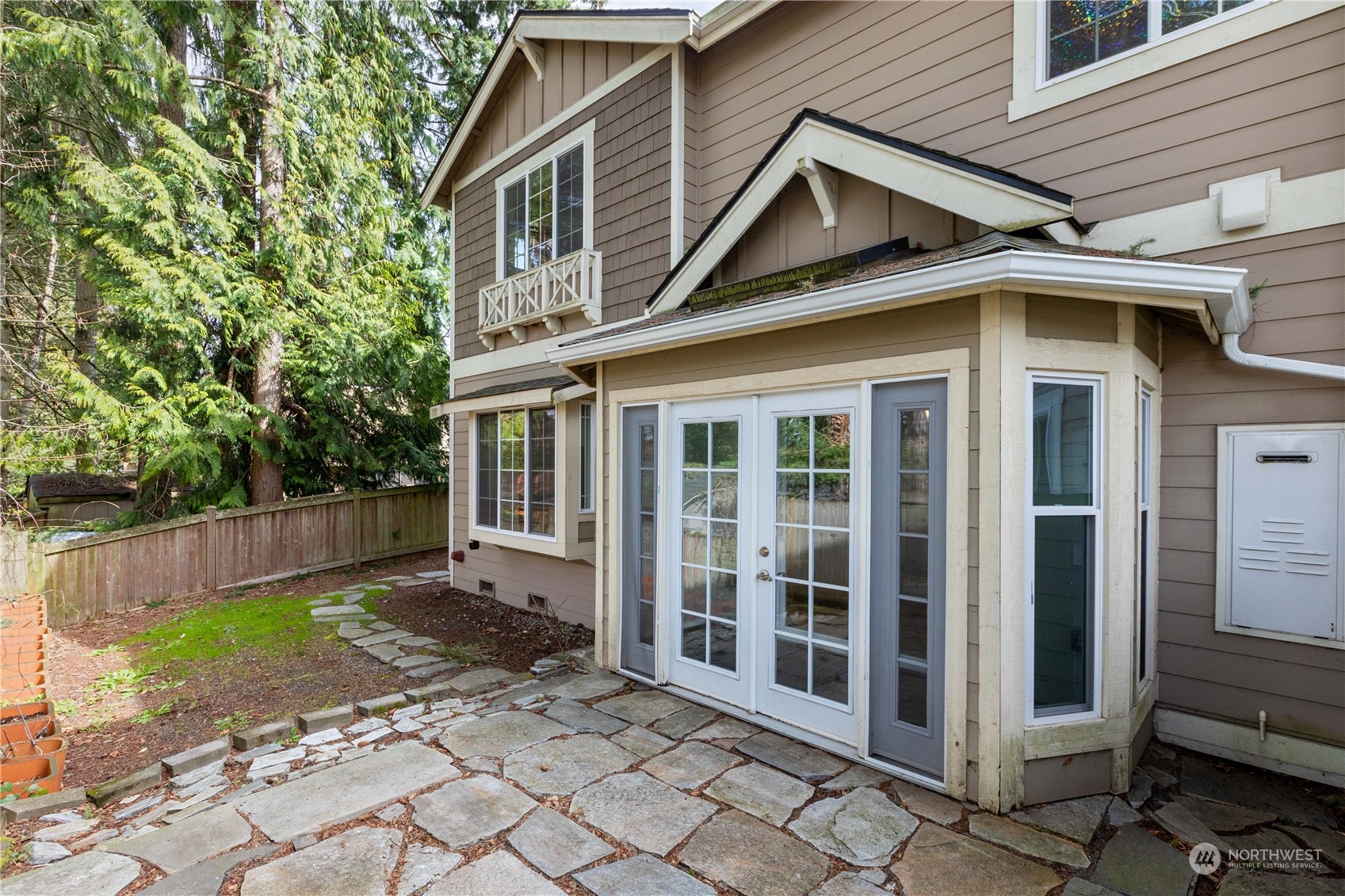 20734 76th Avenue West, Unit D Edmonds, WA 98026 - Photo 28 of 32 a view of a house with a yard and large tree