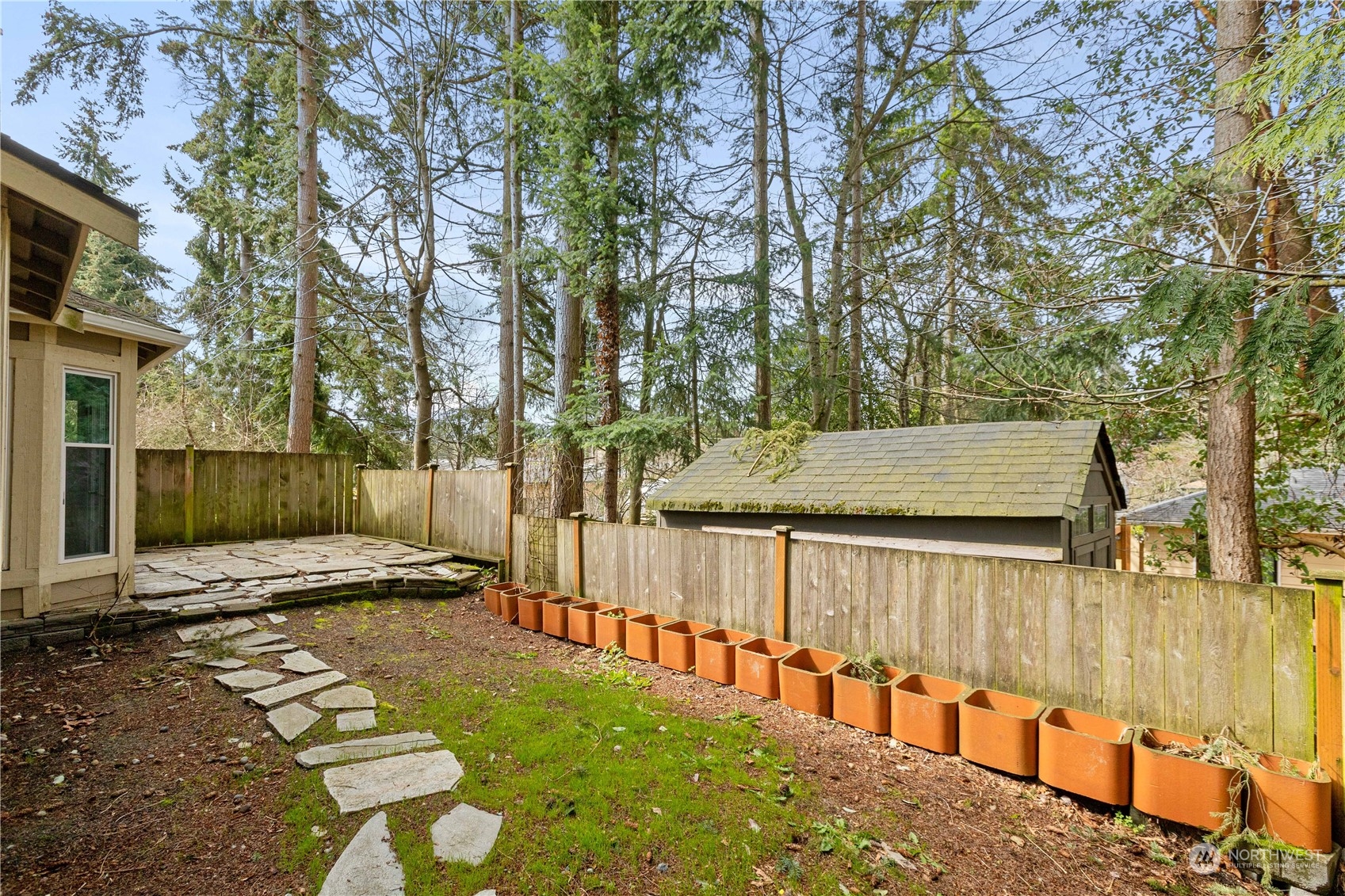 20734 76th Avenue West, Unit D Edmonds, WA 98026 - Photo 30 of 32 a view of street with wooden fence