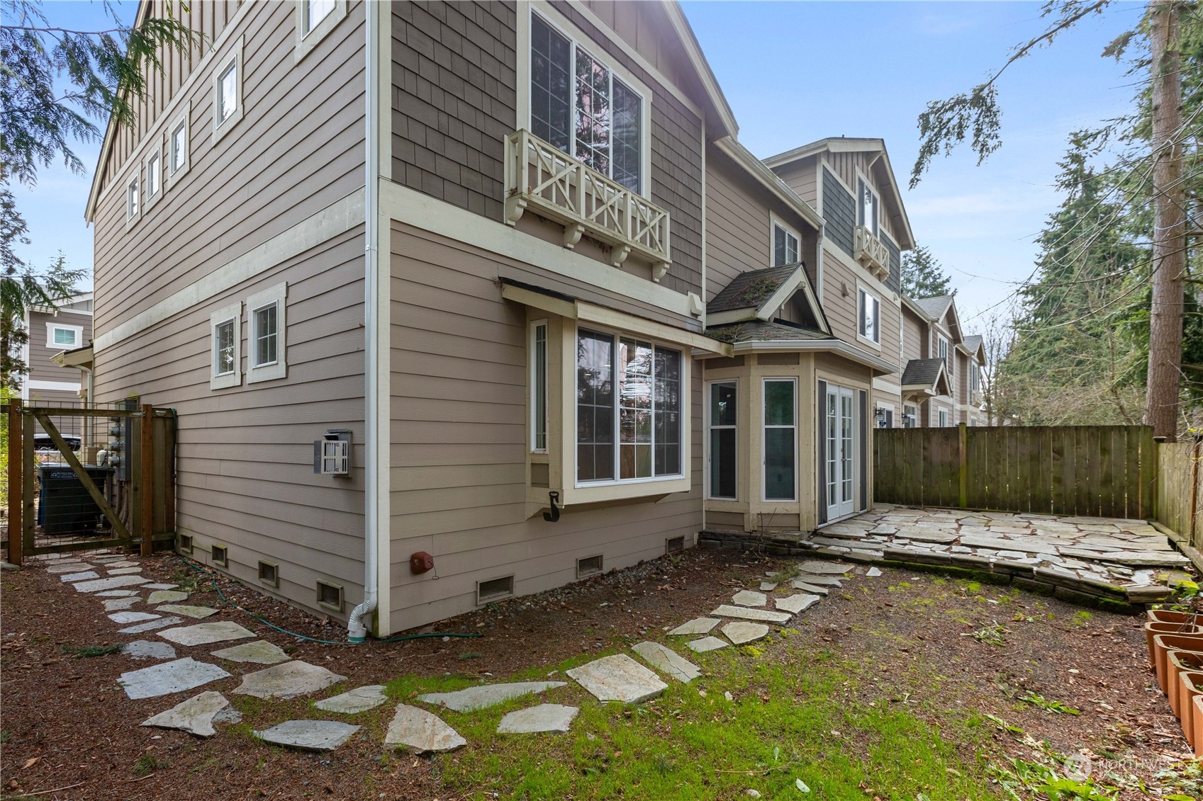 20734 76th Avenue West, Unit D Edmonds, WA 98026 - Photo 31 of 32 a view of a house with a yard