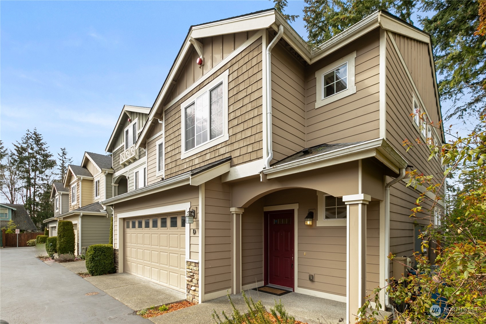 20734 76th Avenue West, Unit D Edmonds, WA 98026 - Photo 32 of 32 a front view of a house with a yard