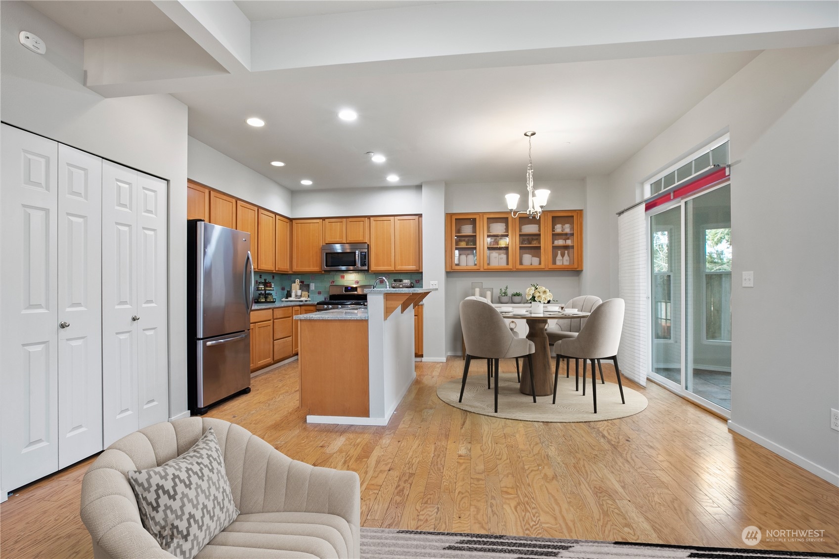 20734 76th Avenue West, Unit D Edmonds, WA 98026 - Photo 6 of 32 a living room with furniture a dining table and kitchen view with wooden floor