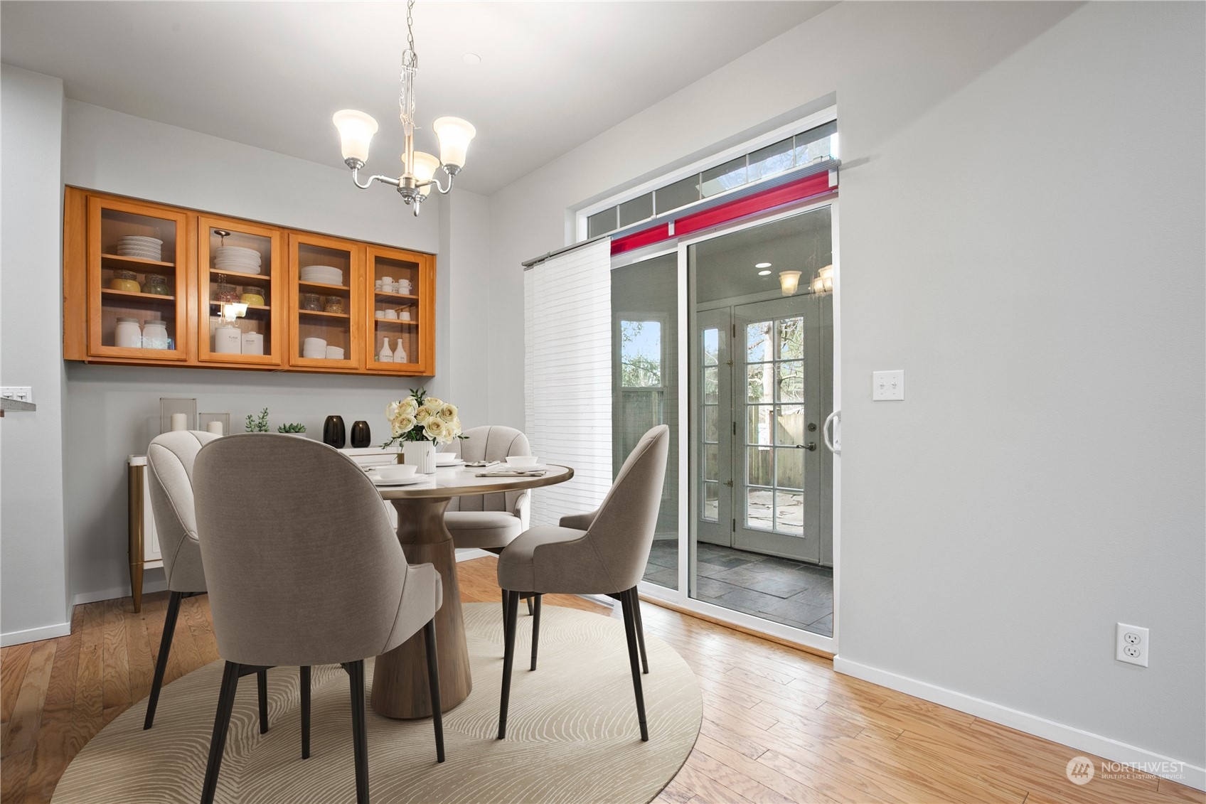 20734 76th Avenue West, Unit D Edmonds, WA 98026 - Photo 10 of 32 a view of a dining room with furniture wooden floor and chandelier
