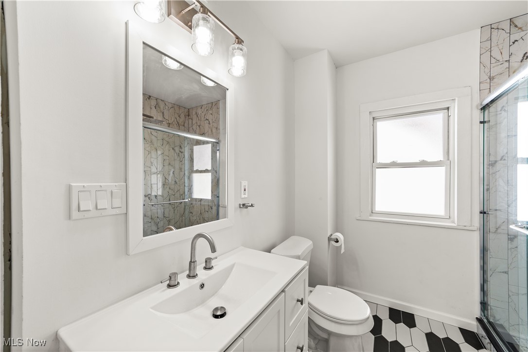 3383 Tullamore Road Cleveland, OH 44118 - Photo 27 of 36 Bathroom with a marble finish shower, plenty of natural light, and vanity