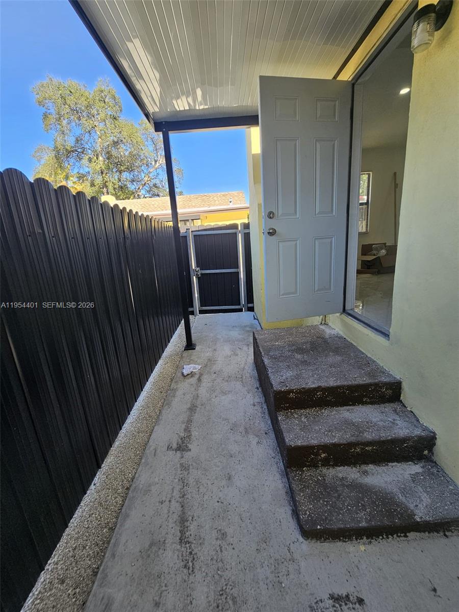 1148 Northwest 100th Street, Unit 2 Miami, FL 33150 - Photo 15 of 22 a view of a entryway door of the house