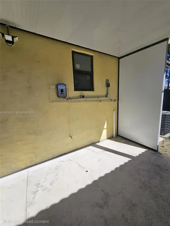 a view of a livingroom with a flat screen tv