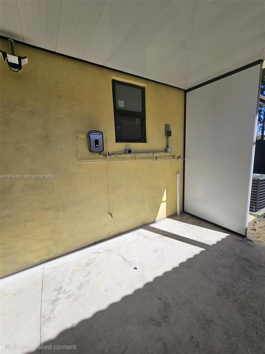 1148 Northwest 100th Street, Unit 2 Miami, FL 33150 - Photo 18 of 22 a view of a livingroom with a flat screen tv