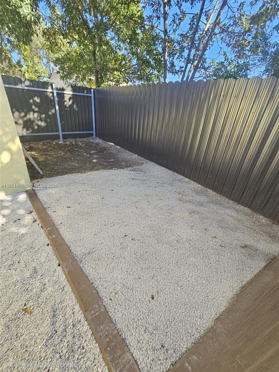 1148 Northwest 100th Street, Unit 2 Miami, FL 33150 - Photo 20 of 22 a view of a backyard