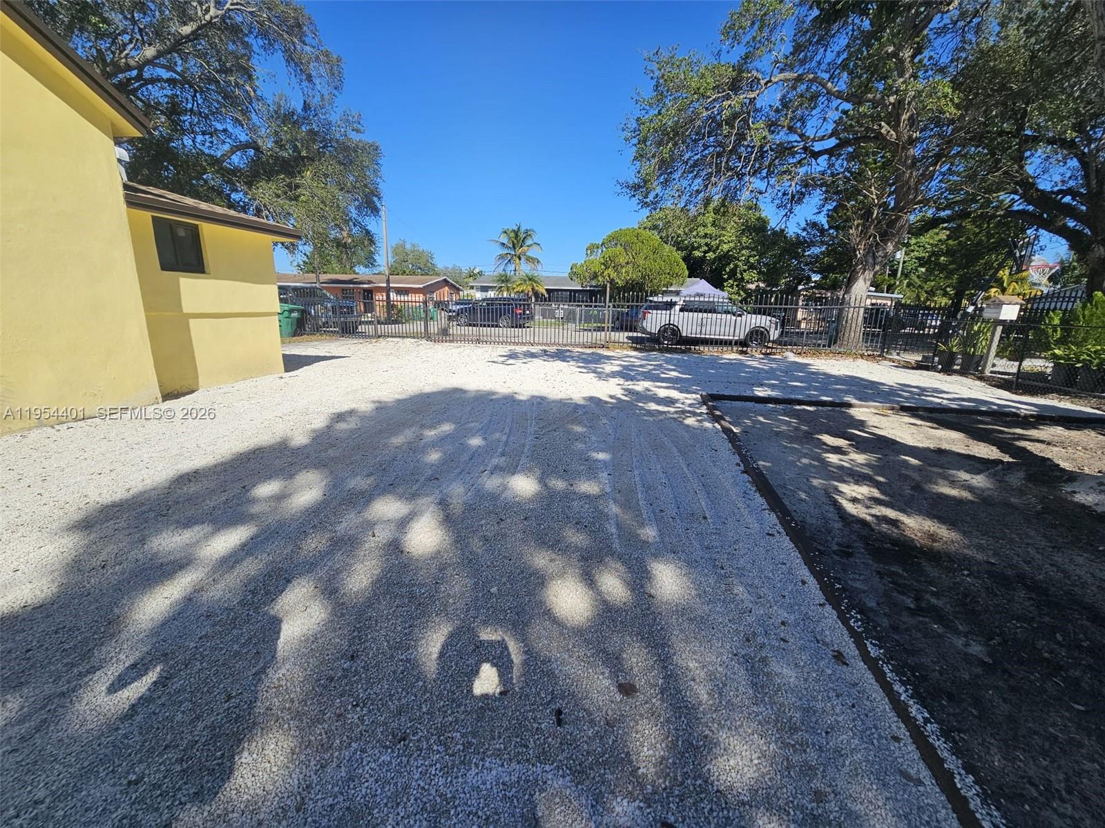 1148 Northwest 100th Street, Unit 2 Miami, FL 33150 - Photo 21 of 22 a view of a yard with a house
