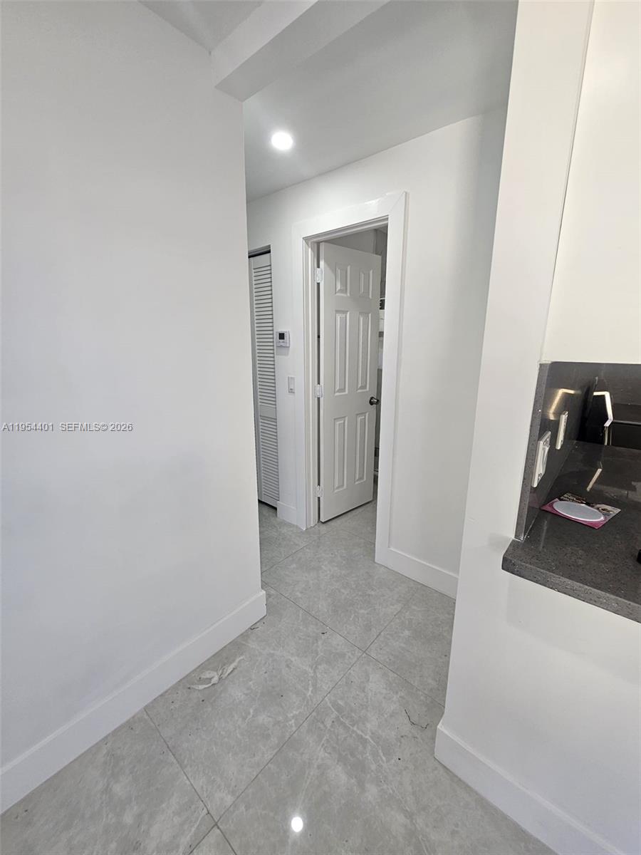 1148 Northwest 100th Street, Unit 2 Miami, FL 33150 - Photo 6 of 22 a view of a sink and a mirror