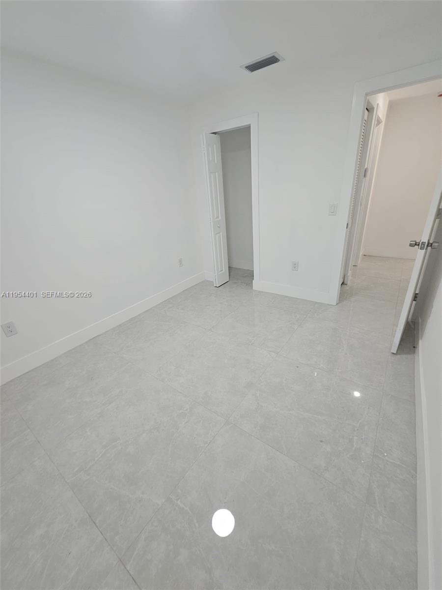 1148 Northwest 100th Street, Unit 2 Miami, FL 33150 - Photo 10 of 22 a view of empty room