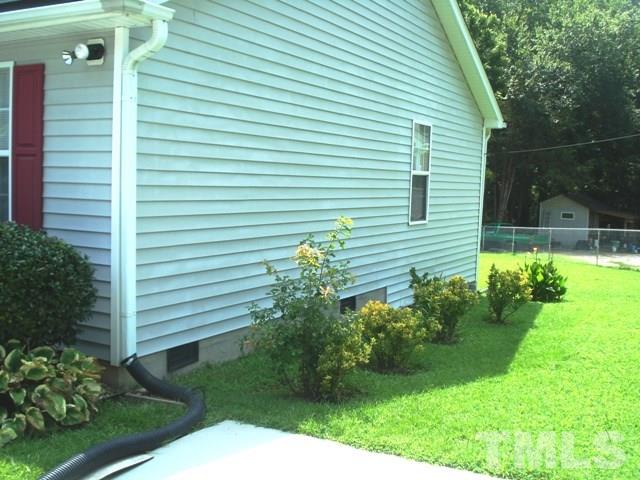 2544 Ross Road Durham, NC 27703 - Photo 2 of 15 a view of a house with a yard and plants