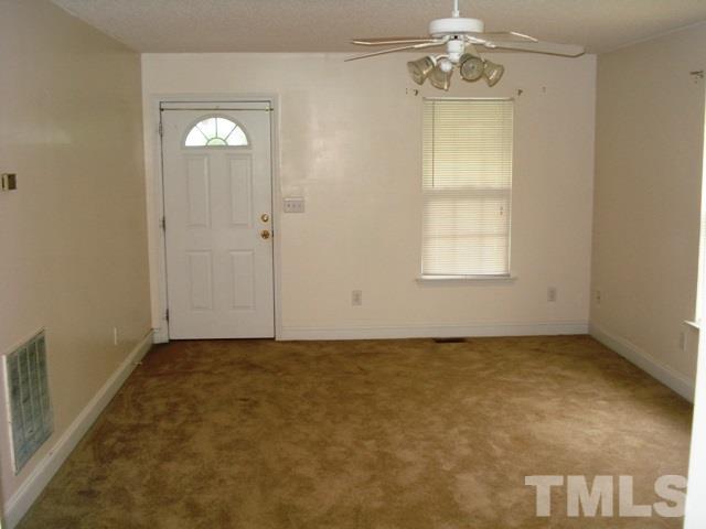2544 Ross Road Durham, NC 27703 - Photo 5 of 15 an empty room with windows and entrance