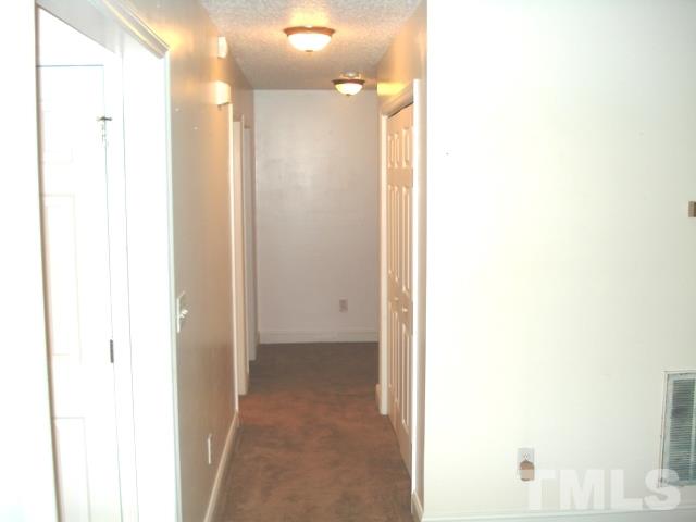 2544 Ross Road Durham, NC 27703 - Photo 6 of 15 a view of a bathroom with a shower and a mirror